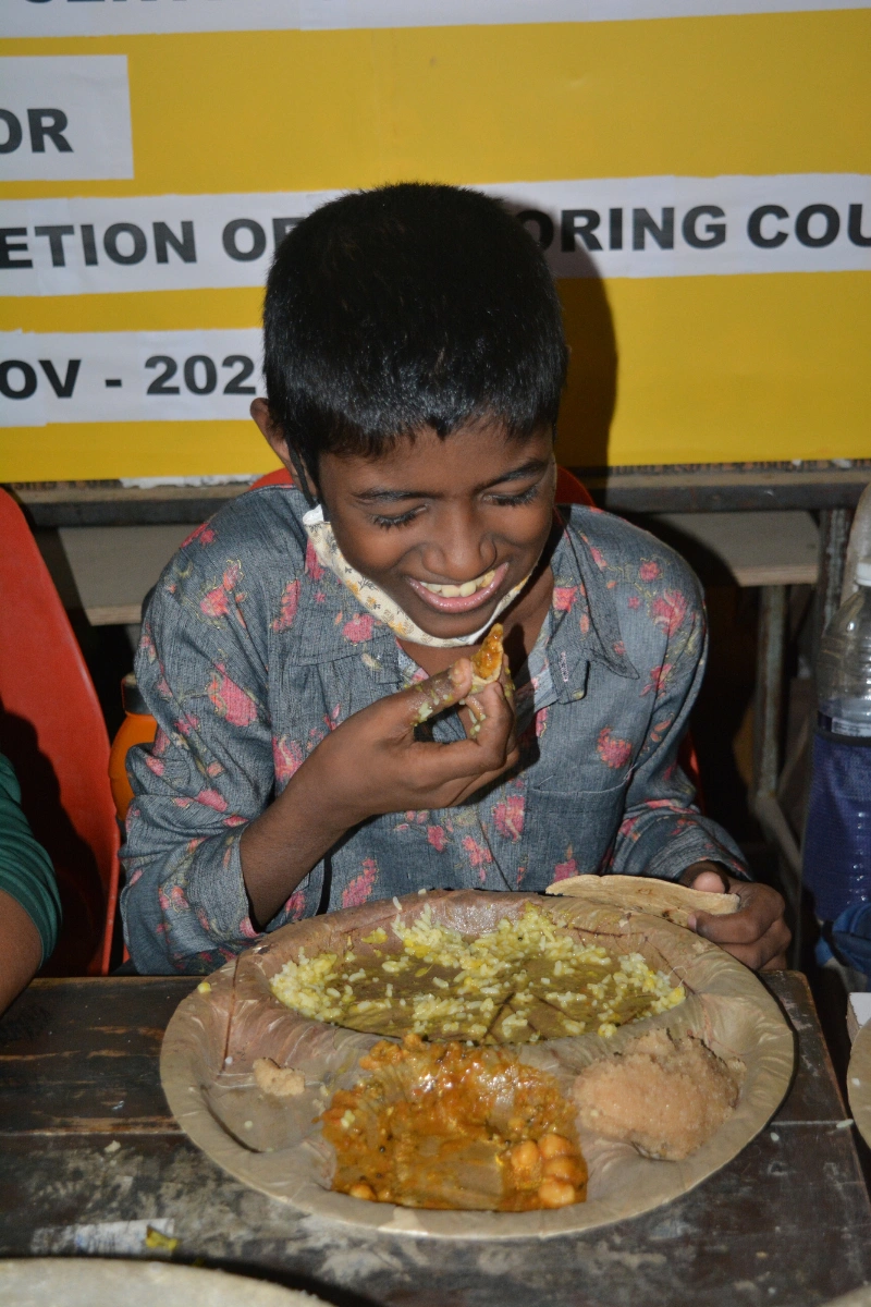 Boy smiling while eating