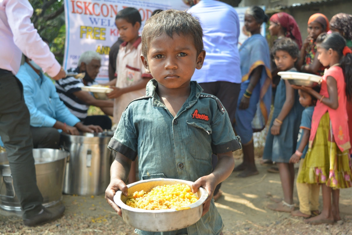 Boy holding meal bowl